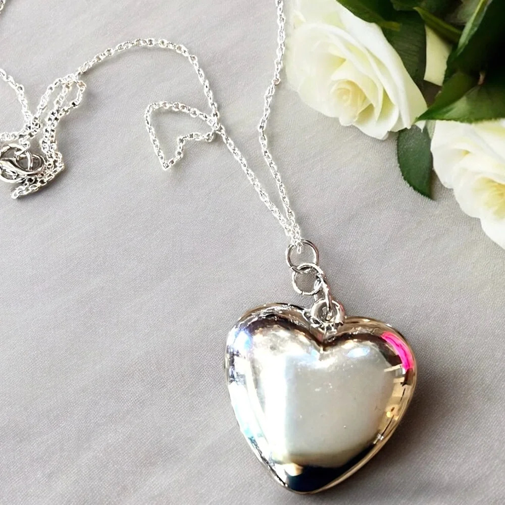 Puffed Silver toned Heart Pendant Necklace on a silver plated chain